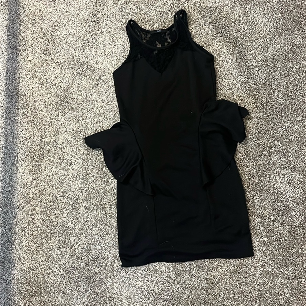 Black dress with lace upper chest area. Size small, brand name is one:11.